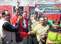 Workers of the state unit of the Samajwadi Party celebrate the announcement of Akhilesh Yadavs candidature as the Chief Minister of Uttar Pradesh, in Dehradun on Saturday