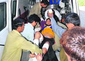 An injured undertrial, Naseem, being taken to hospital after a shootout in Jhajjar on Saturday