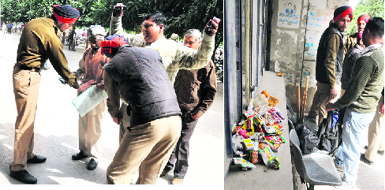 Policemen search visitors to the District Courts Complex in Ludhiana; and (right) tobacco products seized after frisking