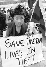 A Tibetan monk takes part in a procession in Guwahati on Saturday. The procession is being taken out to mark the 53rd anniversary of Tibets National Uprising Day and protest against Chinas crackdown on demonstrations across Tibet.