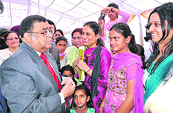 Supreme Court Judge Altamas Kabir interacts with the inmates of Jyoti Sarup Kanya Asra Society and Bal Sansar in Mohali. 