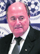 FIFA president Joseph Sepp Blatter arrives at a press conference in New Delhi