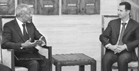 Syrias President Bashar al-Assad (R) with UN-Arab League envoy Kofi Annan in Damascus. 