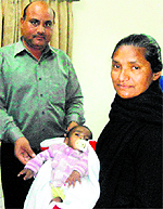 The child being handed over to a childline volunteer in Amritsar on Sunday