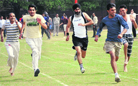 Athletes take part in a 100m race at the Sports Complex in Sector 46, Chandigarh, on Sunday.
