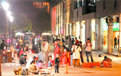 Visitors enjoy an evening at the Sector-17 plaza. 