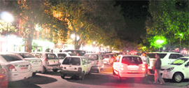 A view of the parking lot near Neelam Theatre in the evening.