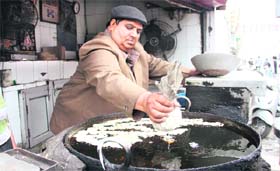 Ashok Kumar makes jalebis at his 65-year-old shop on Jail Road in Jalandhar