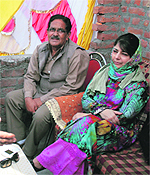 PDP president Mehbooba Mufti listens to grievances of people in Bhagwati Nagar during a public meeting in Jammu on Sunday. 