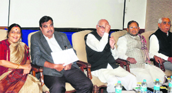 (L-R) BJP leaders Sushma Swaraj, Nitin Gadkari and LK Advani at a meeting in New Delhi