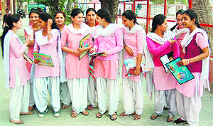 Class XII students come out smiling after their first examination of the Punjab State Education Board in Amritsar on