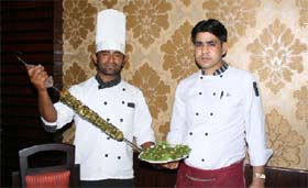 The chef of Moti Mahal preparing tandoori food items for the clientele