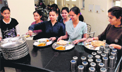 Girl residents of hostel number 3, Panjab University, take their food from the mess
