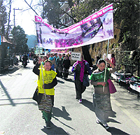 women demonstrate in Mussoorie