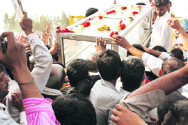 The body of Sandeep, who died in a clash with the police, is loaded on a tractor-trailer for cremation at Ramayan village, near Hisar, on Monday.