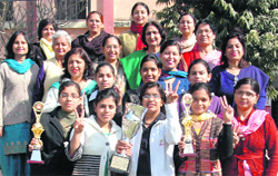Students of Hindu Girls College celebrate their win with principal Nirmal Jabbal and other staff members in Sonepat