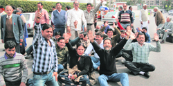 Supporters of veteran Congress leader Mangat Ram Sharma protest against the party high command in Jammu