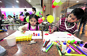 Children participate in a painting contest at a food joint in Ludhiana on Monday.