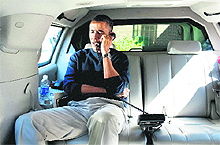 President Barack Obama talks on the phone with Afghanistan President Hamid Karzai.