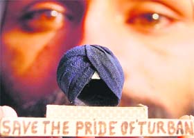 Vote for turban: Gurpreet Singh of Amritsar has created a miniature turban out of one inch of cloth. The turban weighs 15 gram only