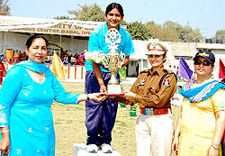 A girl receiving prize during the annual sports meet of the Dasmesh Girls College, Badal, in Muktsar district on Tuesday