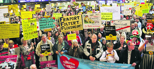People take part in a demonstration to protest against aircraft noise and the northwest runway at the main terminal of Frankfurt/Main international airport, the third busiest in Europe (after London Heathrow and Paris-Charles de Gaulle) and the ninth busiest worldwide, on Monday. 