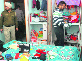 Officials inspect the burgled house at Sector 68 in Mohali on Tuesday. 