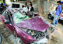 The mangled remains of the car at the Saket police station in New Delhi on Tuesday. 