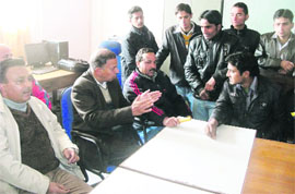 Students in a heated discussion with the college staff in the Principals office of MPG College in Mussoorie