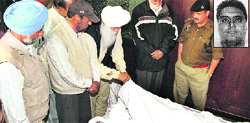 Family members of Harinder Paul Singh (inset) in the hotel room where his body was found.