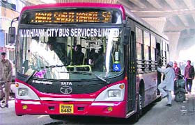 A man boards a bus near the Mata Rani Chowk in Ludhiana