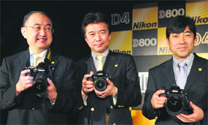 Hiroshi Takashina (L), Managing Director, Nikon India, with Toshiaki Akagi (C), General Manager, designing and development, and Toru Iwaoka, General Manager, Marketing, Nikon Corporation, at the launch of new cameras in New Delhi on Wednesday. Nikon launched two new professional cameras in India.