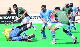 Players in action during the All-India Audit and Accounts General Hockey Tournament at the Sports Complex in Sector 42 on Wednesday