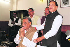 Vijay Bahuguna takes over as Chief Minister at his office in the Civil Secretariat in Dehradun on Wednesday. Congress chief Yashpal Arya is also seen in the picture.