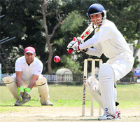 A batsman in action in a match during the 60th Dehradun District Cricket Tournament in Dehradun