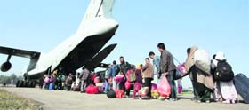 Passengers bound for Leh queue up to board an IL-76 of the IAF in Jammu on Wednesday