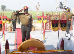 Brigadier Arul Dennis saluting the martyrs after laying wreaths at the war memorial in village Asafwala in Fazilka district. 