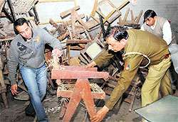Police officials inspect the heritage furniture recovered from a godown at Nayagaon on Thursday
