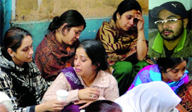 Grieving family members of Harvinder Singh (inset), who was allegedly shot by his friend in northwest Delhi on Thursday.