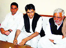 Rohtak MP Deepender Singh Hooda (centre) interacts with mediapersons at Bahadurgarh