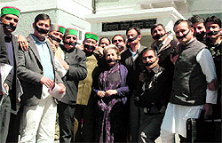 Congress MLAs outside the Vidhan Sabha in Shimla after staging a walkout from the House on Thursday
