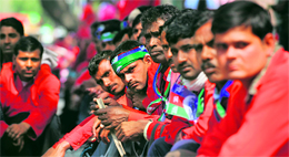 Coolies during a protest, demanding better wages, housing, medical and pension facilities, in New Delhi.
