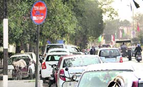 The signboard declaring the area as a tow-away zone perhaps does not act as a deterrent for vehicle owners, who have parked their cars near Circuit House, in Jalandhar on Thursday