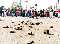 Bricks lie scattered on the road at Ratan Singh Chowk area after residents go on a rampage on Friday