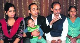 Kamal Joshi with his family at his house in Mansa Devi Complex in Panchkula on Friday. 