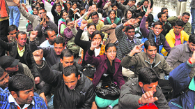 JBT teachers raise slogans in support of their demands outside the Vidhan Sabha in Shimla on Friday.