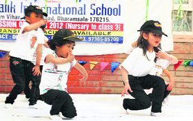 Students present an item during the annual day function of Shivalik International School in Dharamsala on Friday.