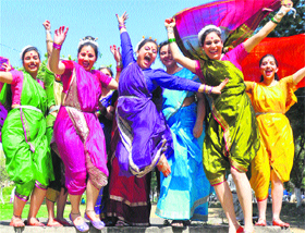 Students in a happy mood after their performance at a folk festival for private affiliated BEd colleges at Jammu University. 