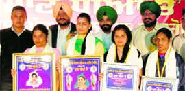 Commonwealth Games gold medalist Manjit Kaur along with other women achievers being honoured at Virsa Vihar in Amritsar on Saturday.