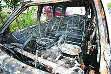 The burnt car.